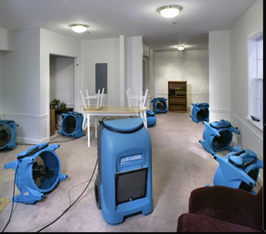 Air movers and dehumidifier setup for Water Damage Restoration in South Run